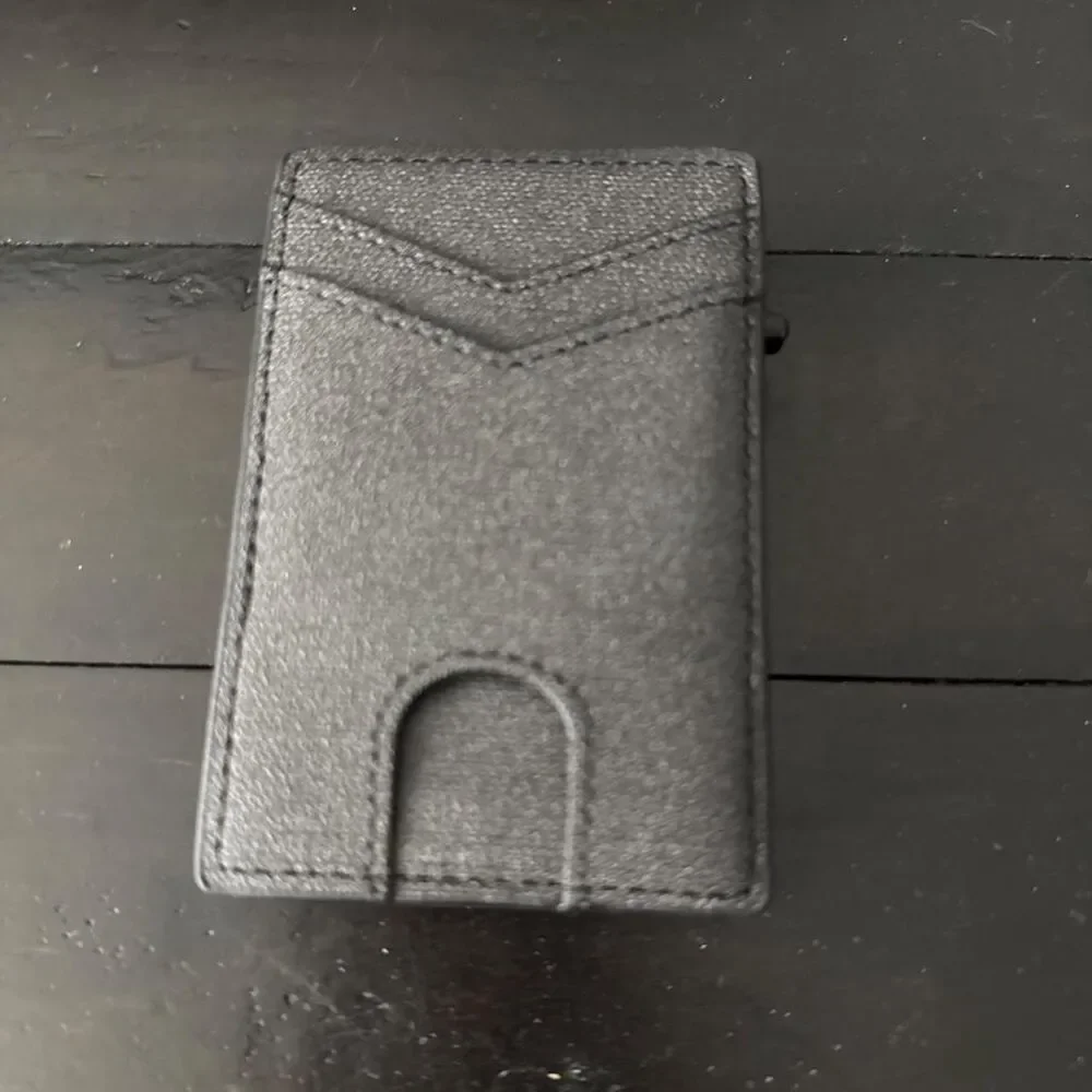 Black leather wallet with textured surface